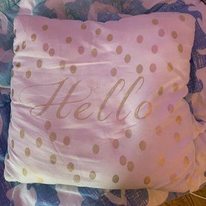 A cute Hello pillow.